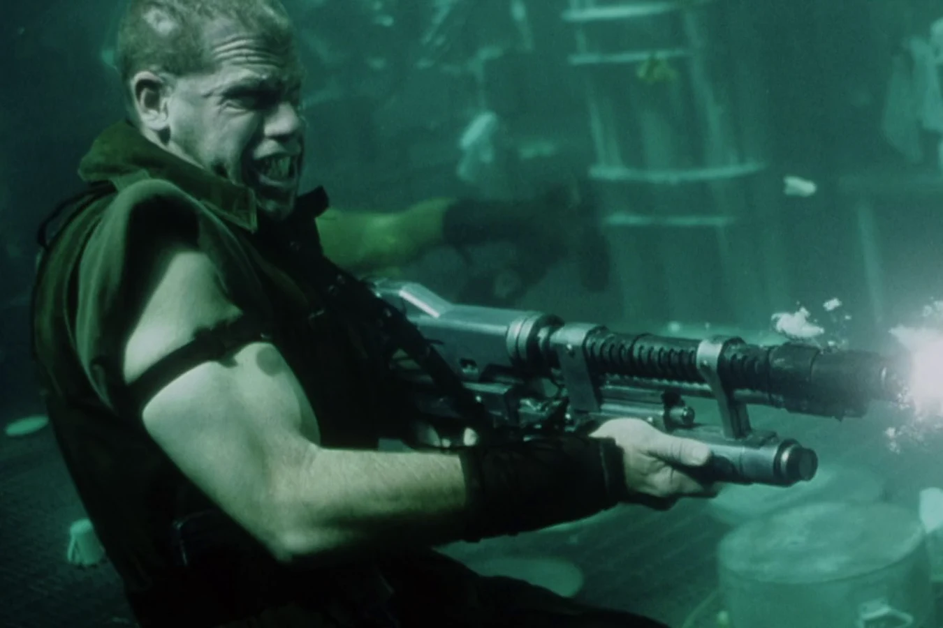 Johner firing his gun underwater in the flooded Auriga kitchen
