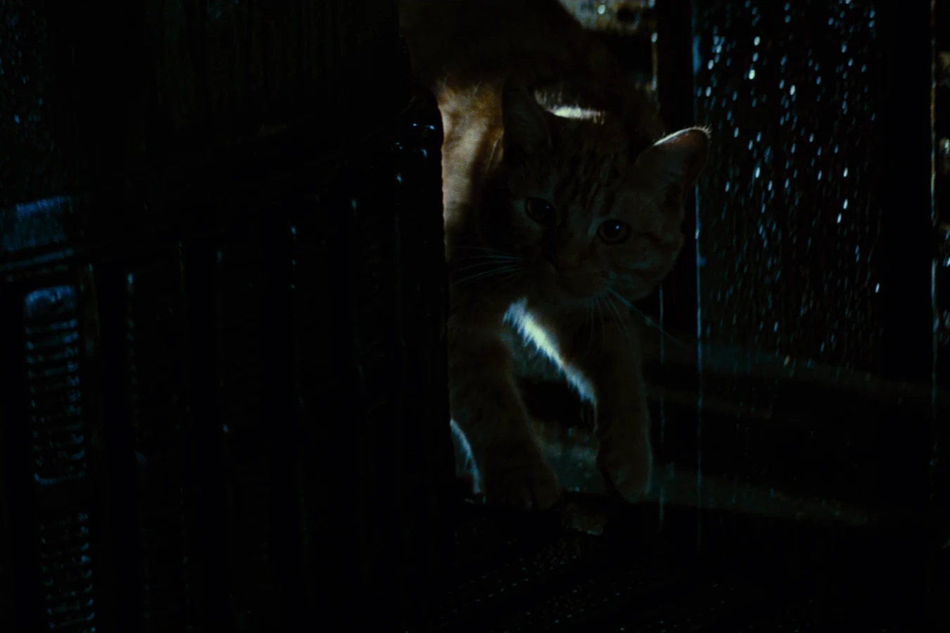 Jones crouched in a Nostromo vent, looking out through the grating
