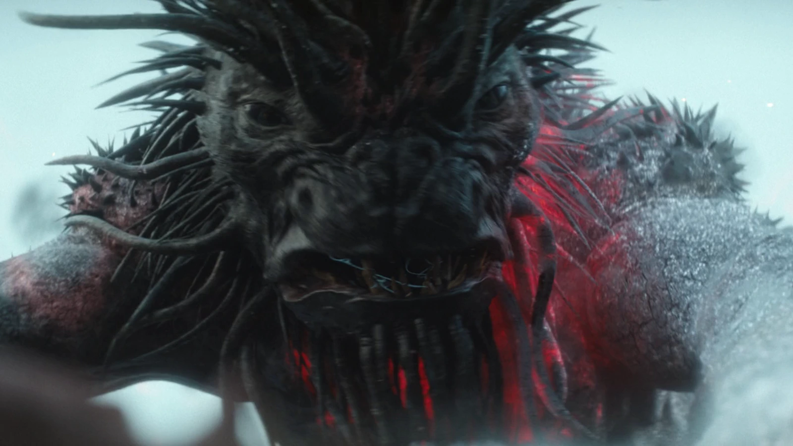 The Kalisk from Predator: Badlands with spiked head and glowing red cracks