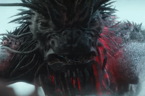 The Kalisk from Predator: Badlands with spiked head and glowing red cracks