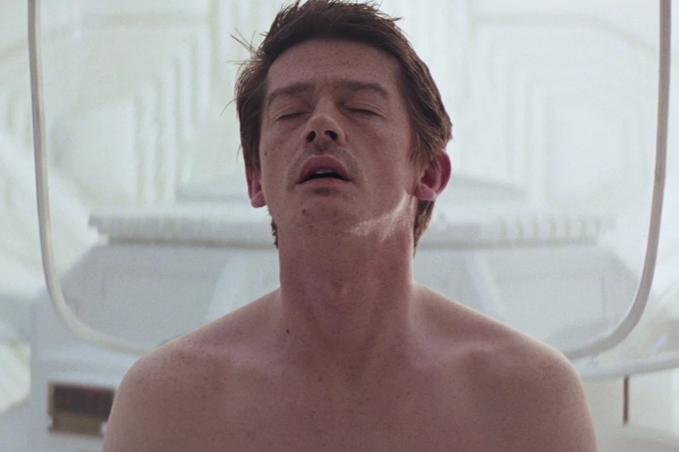 Kane sits up from hypersleep on the Nostromo in Alien