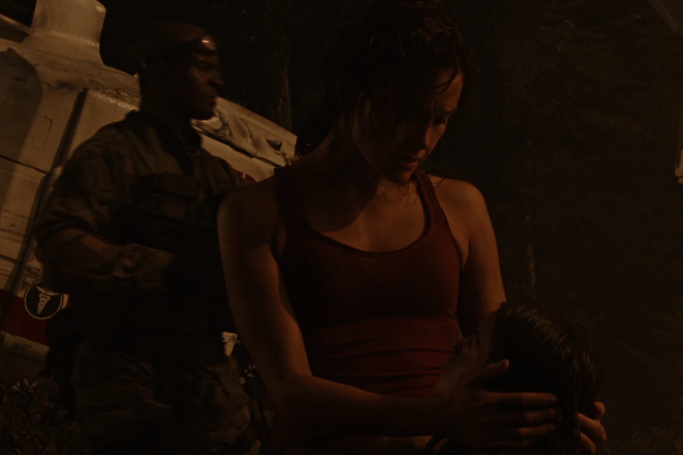 Kelly O'Brien holds Molly at the forest crash site after the nuclear strike on Gunnison