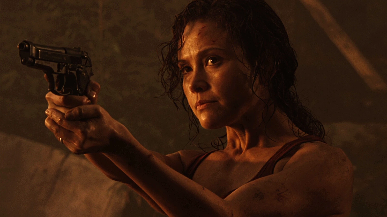 Kelly O'Brien holds a rifle under red light during the Gunnison outbreak in Aliens vs. Predator: Requiem