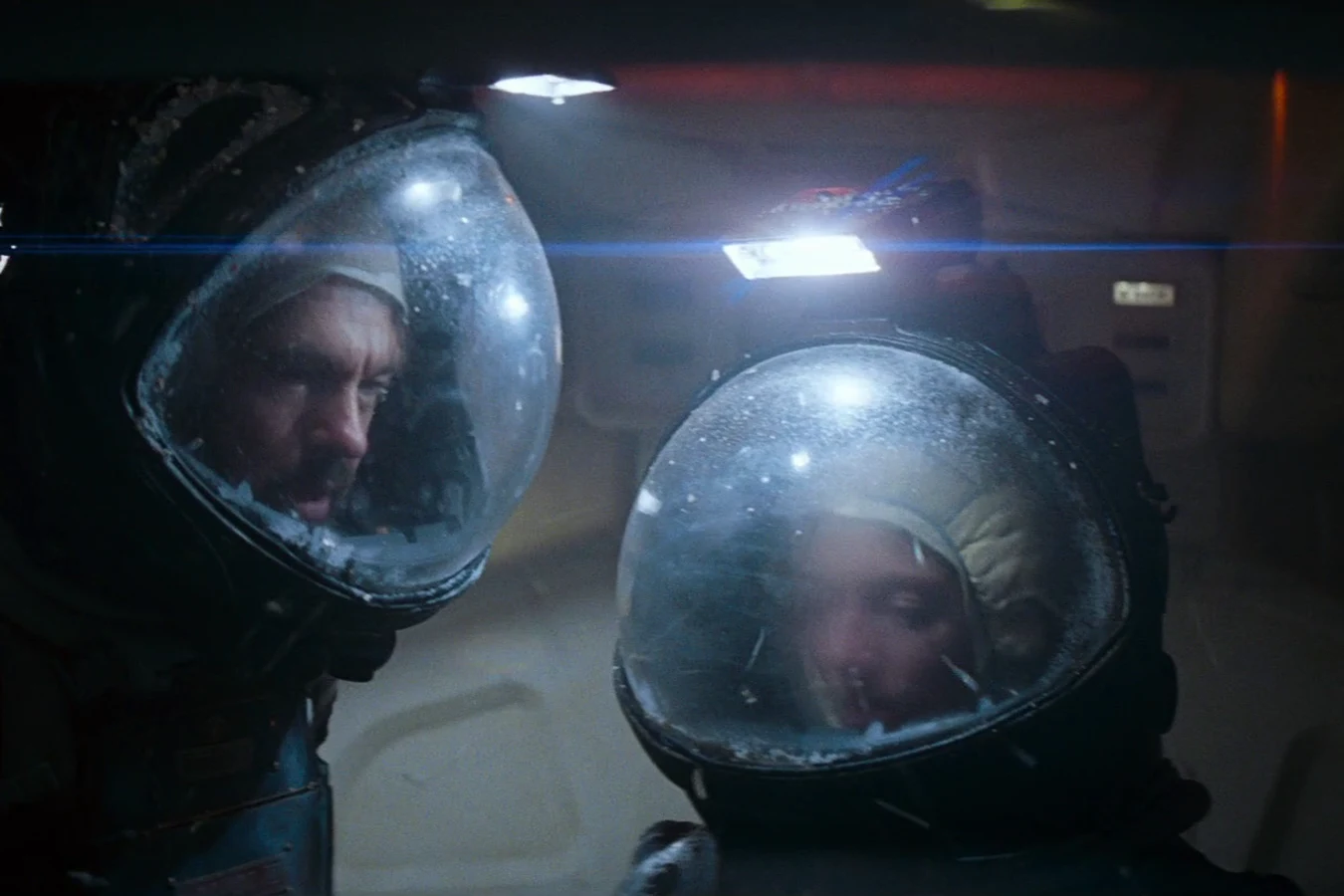 Dallas and Lambert in helmets aboard the Nostromo after the walk on LV-426