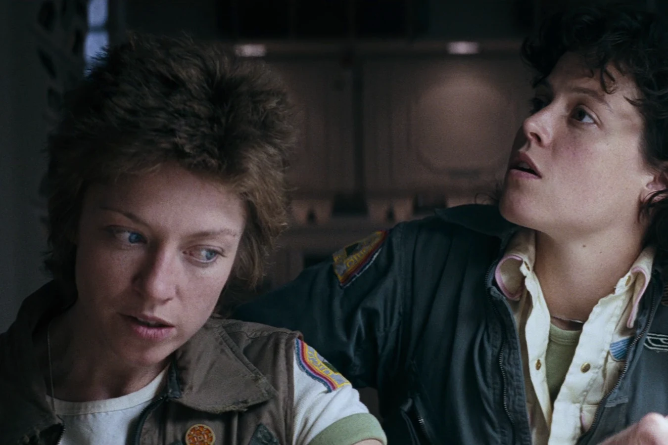 Lambert and Ripley look up together aboard the Nostromo in Alien