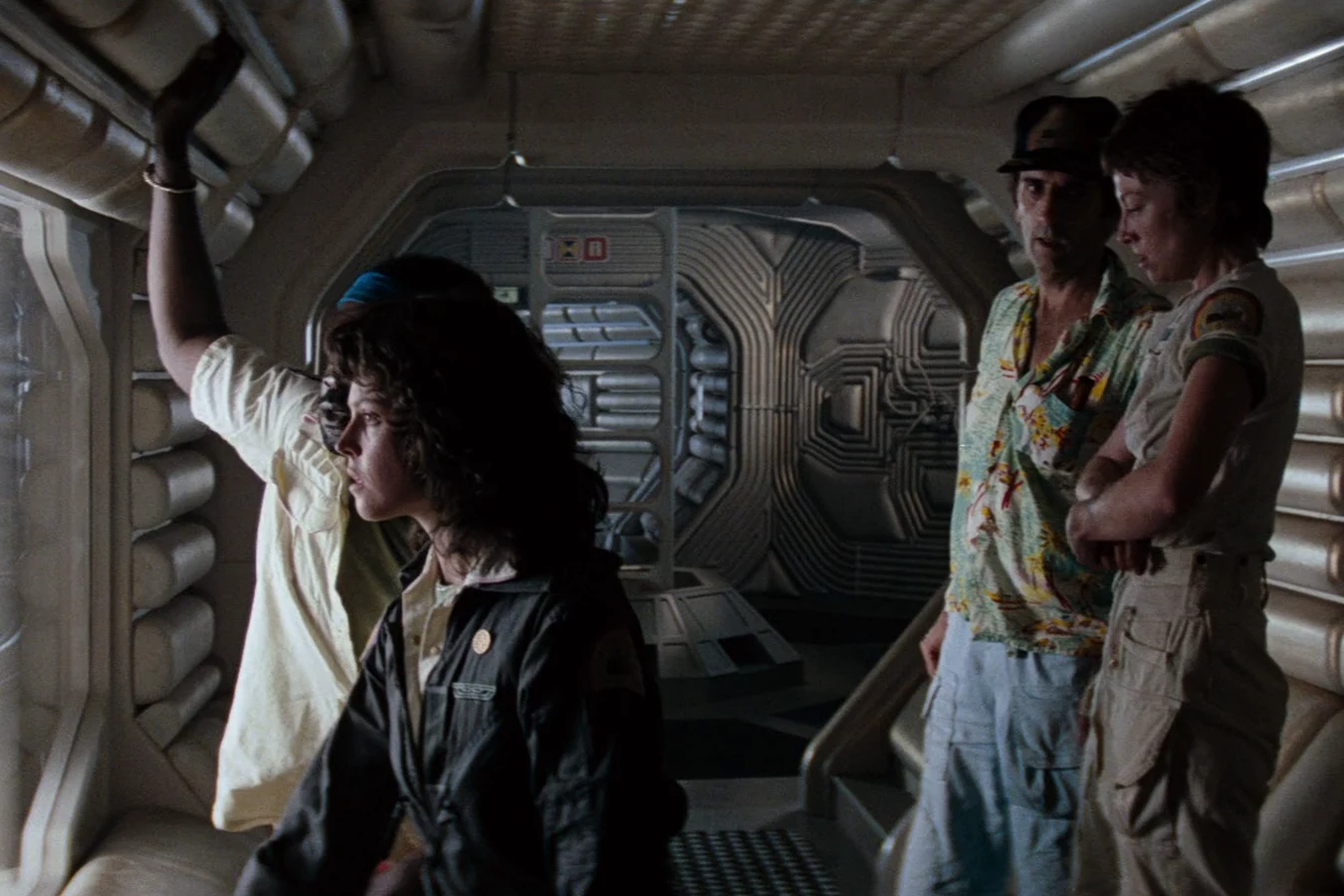 Ripley, Brett, and Lambert at a Nostromo viewport after the landing party returned in Alien