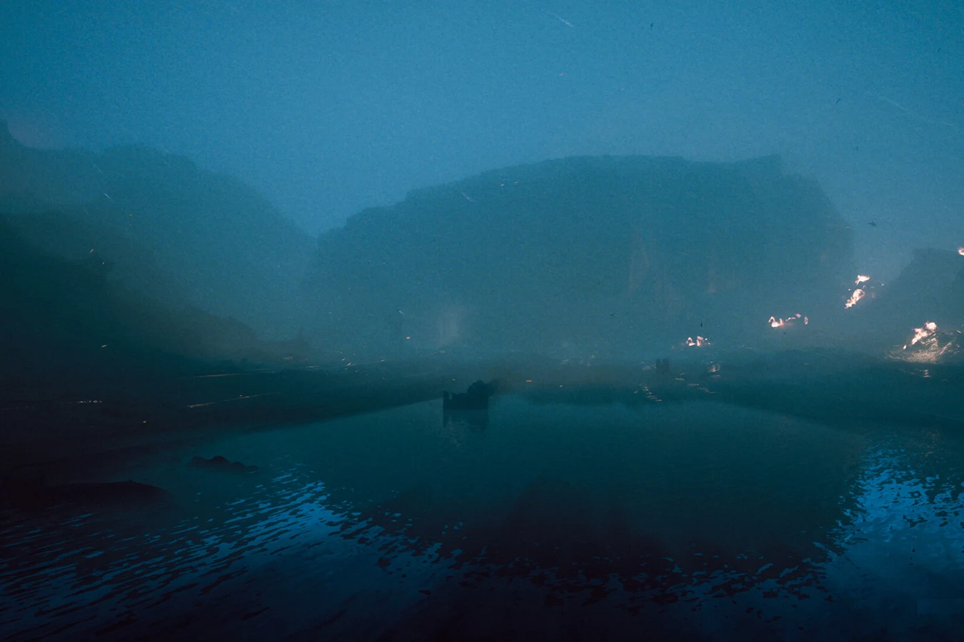 Burning wreckage and water near the Gemini Labs crash on LV-921