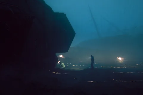 Two surveyors at the Gemini Labs wreck on storm-hit LV-921