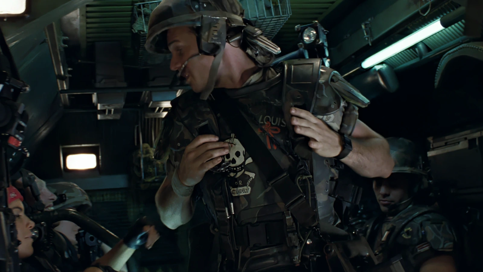 Private Hudson buckling his M3 armor and M10 helmet inside the APC in Aliens