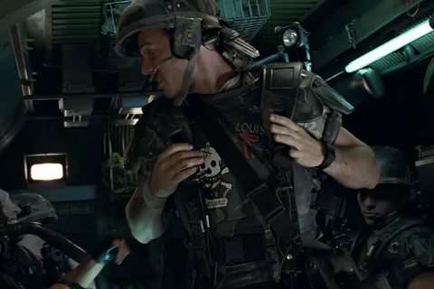 Private Hudson buckling his M3 armor and M10 helmet inside the APC in Aliens
