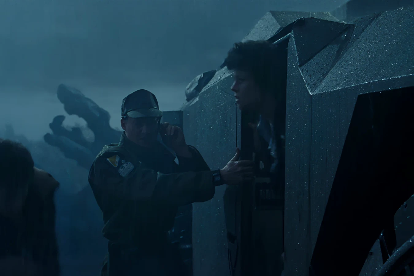 Lieutenant Gorman at the M577 side hatch with Ellen Ripley looking out from the APC interior in Aliens