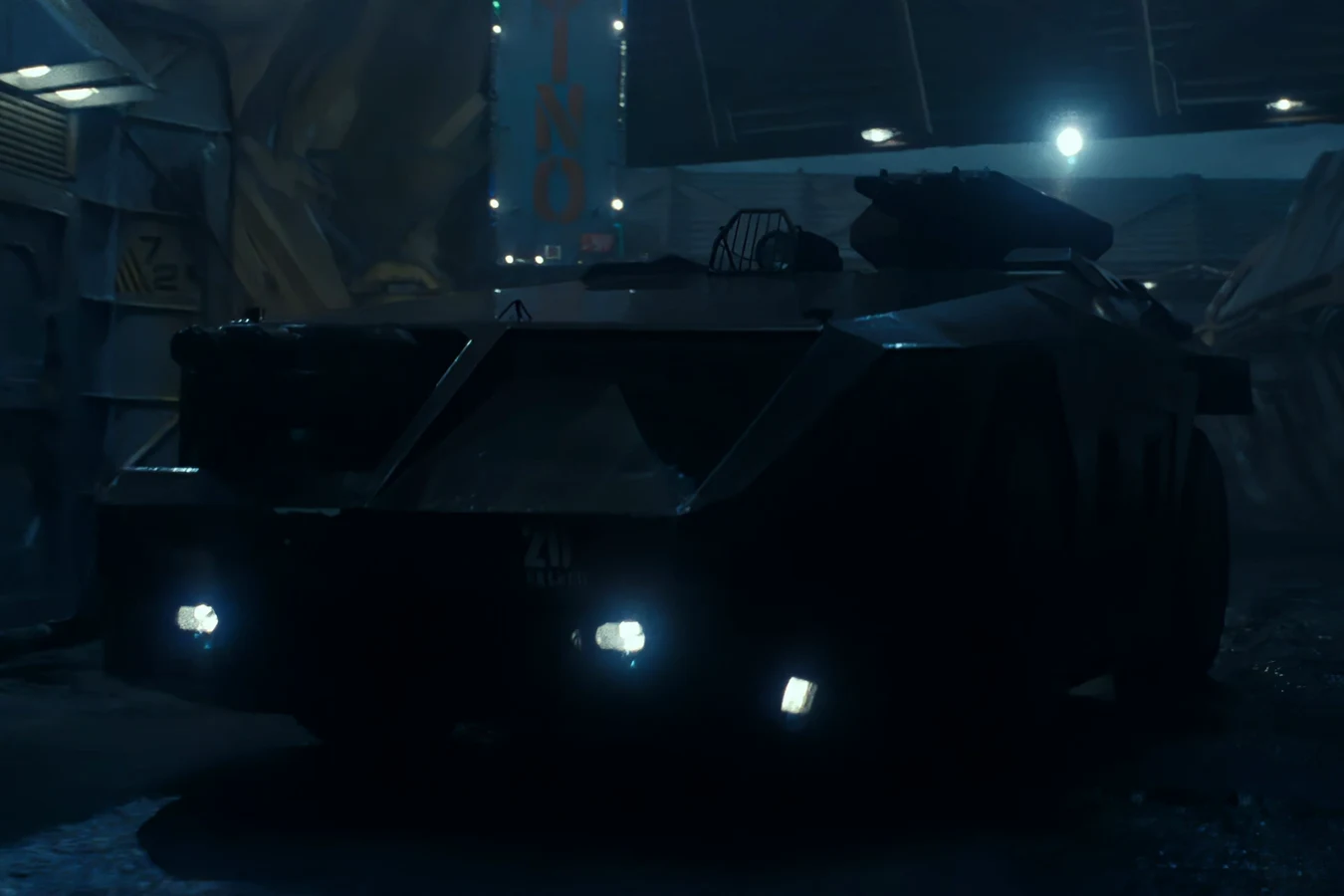 The M577 APC inside Hadley's Hope in Aliens, headlights on, with the forward RE700 cupola and roof turret visible