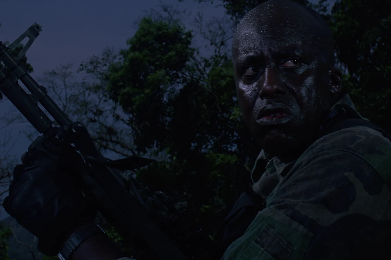 Mac Eliot on night alert in the jungle after Blain's death in Predator