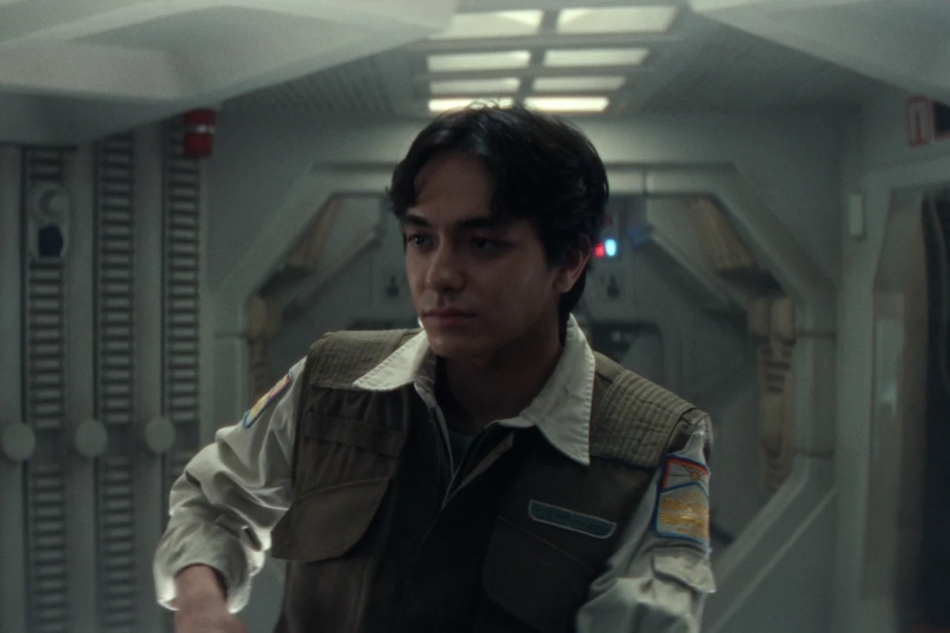 Clem Madey in his Maginot security vest in a ship corridor in Alien: Earth