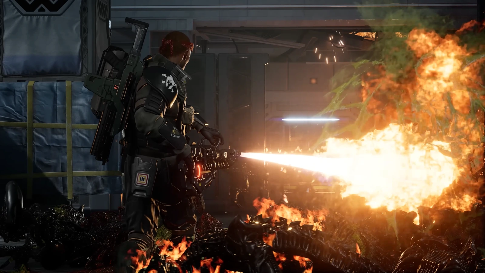Marauder class Marine firing the OCAP-91 Volcan flamethrower with an M12A1 Rocket Launcher on his back in Aliens Fireteam Elite 2