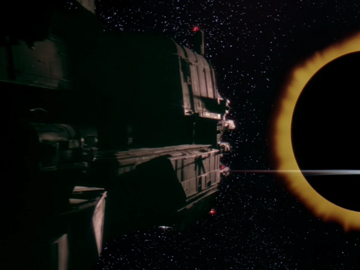 The USCSS Patna in space beside an eclipsed star in Alien 3