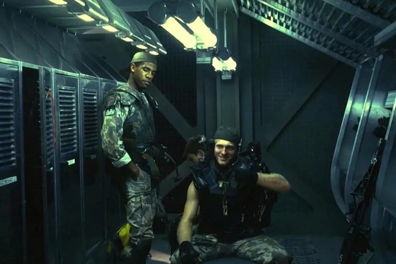 Mark Rolston as Drake in the smartgun harness on the Aliens Sulaco locker set, with Al Matthews as Apone