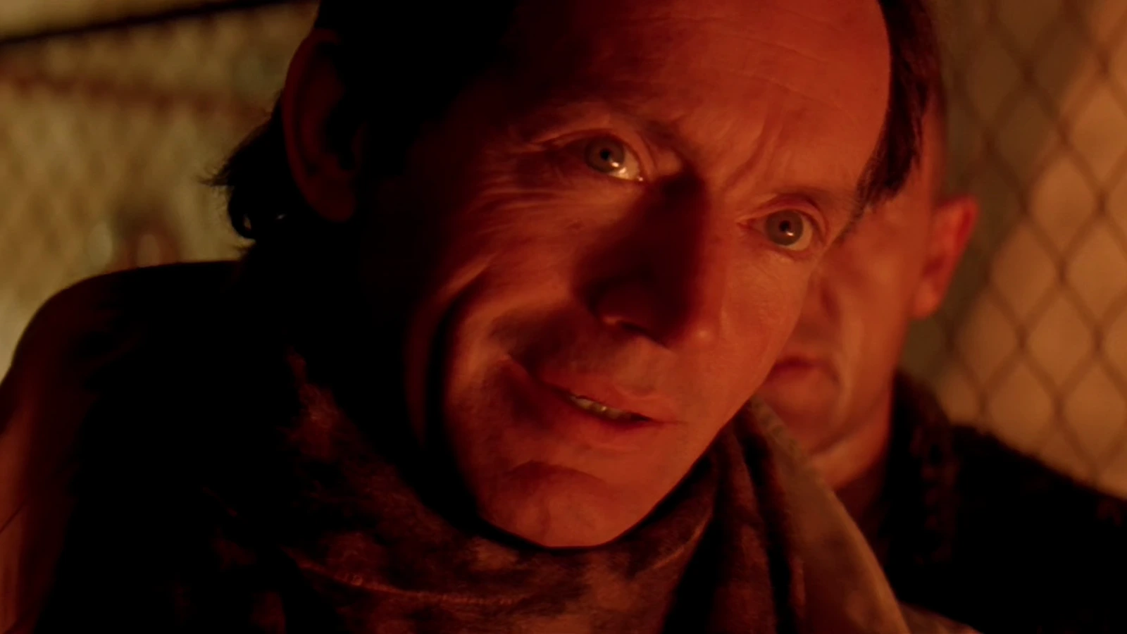 Michael Bishop speaking to Ellen Ripley through a fence on Fury 161 in Alien 3