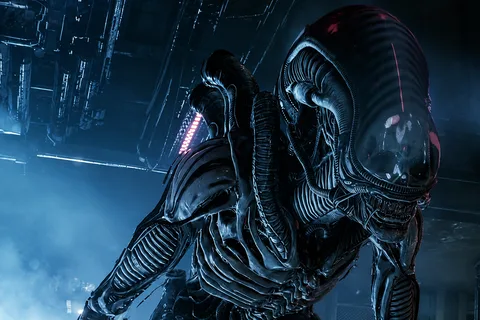 Monica the Pathogen-striped Xenomorph Drone in a dark industrial corridor