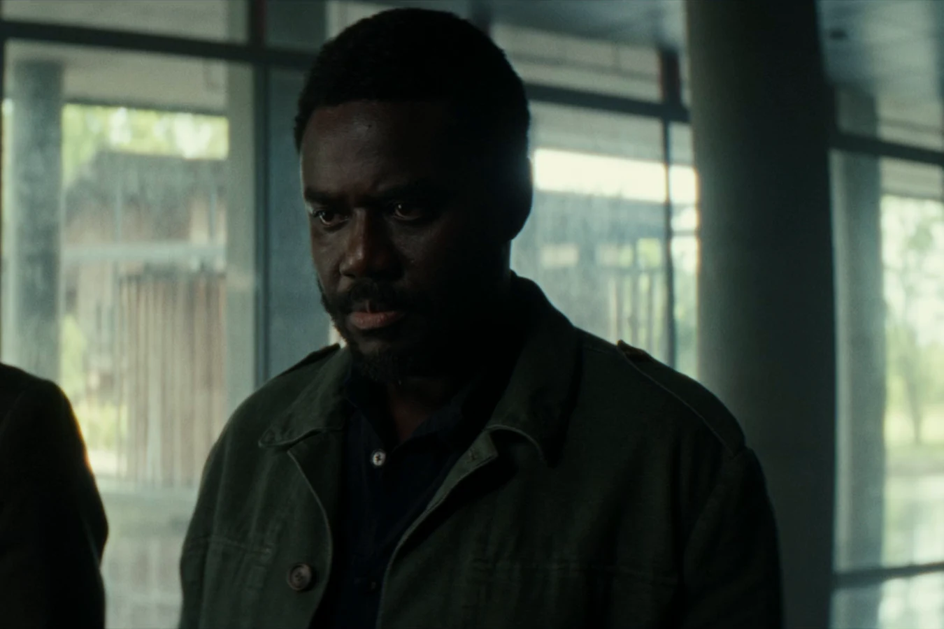 Morrow standing behind Yutani during the arbitration hearing with Prodigy in Alien: Earth