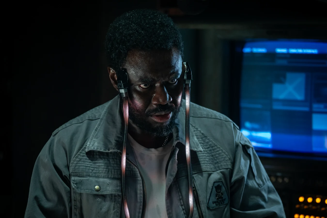 Morrow with data cables running from the ports at his temples to the Maginot computer in Alien: Earth