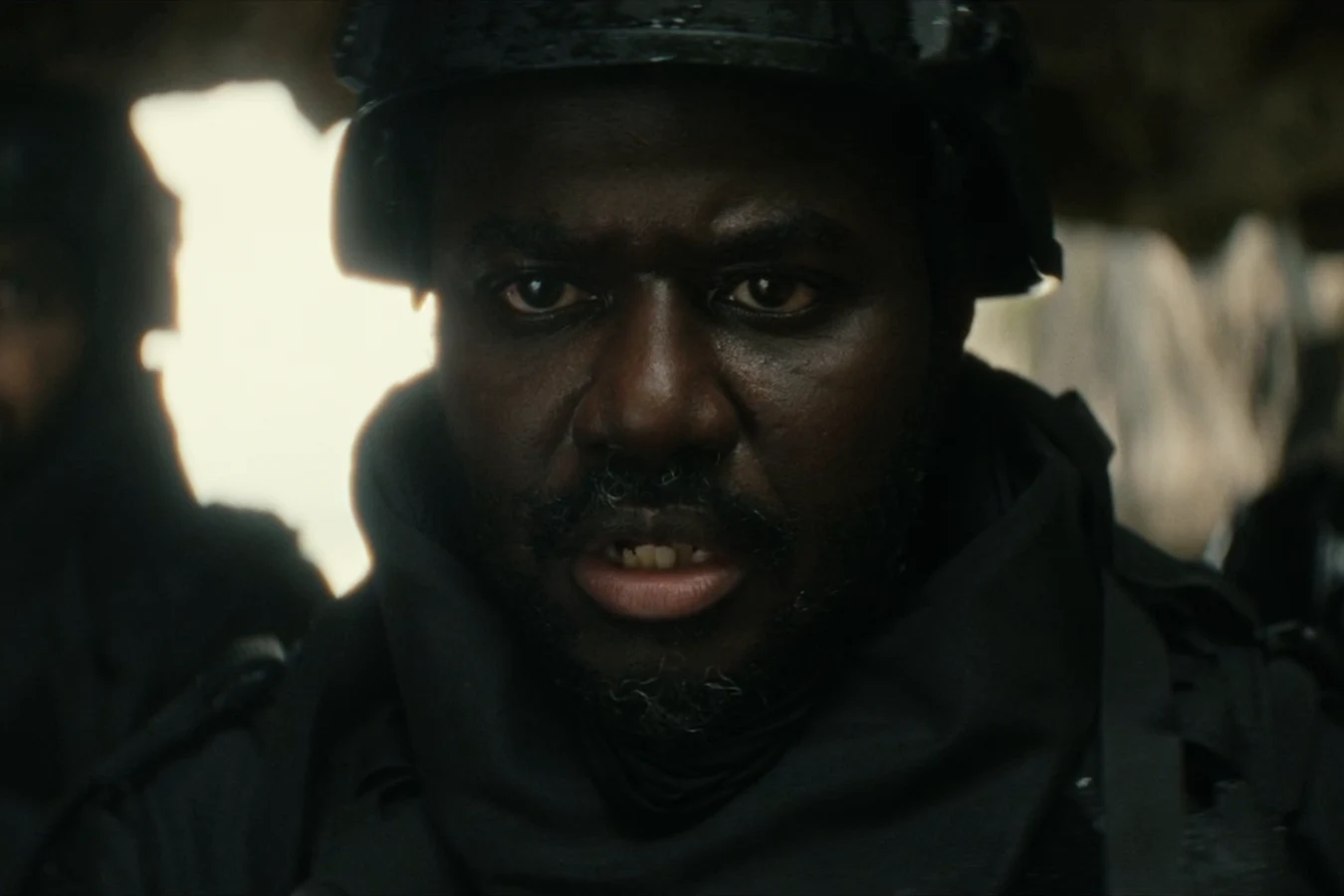 Morrow in a tactical helmet with his Weyland-Yutani team on the shore of Neverland in Alien: Earth