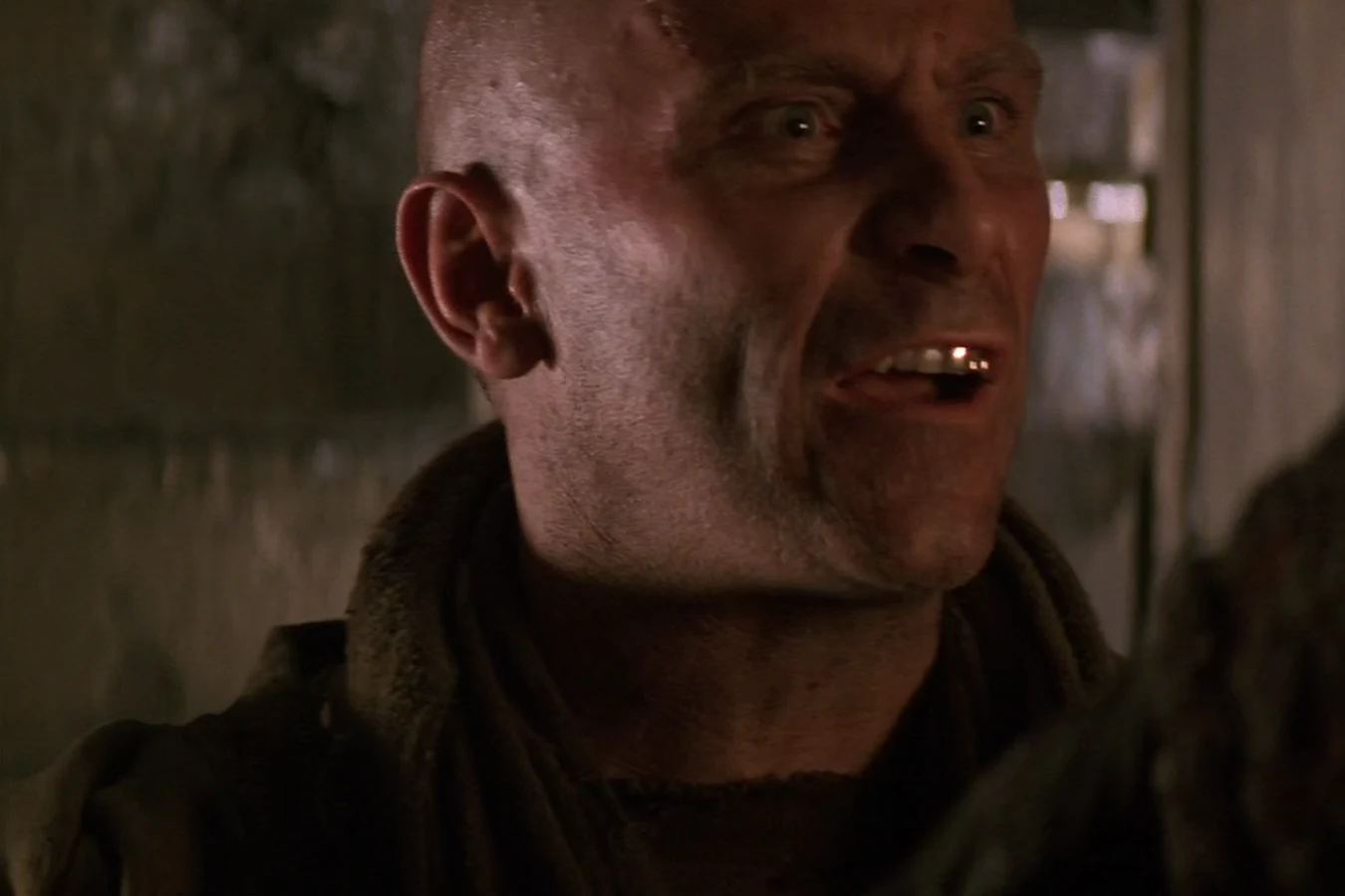 Morse arguing with a gold tooth showing in Alien 3