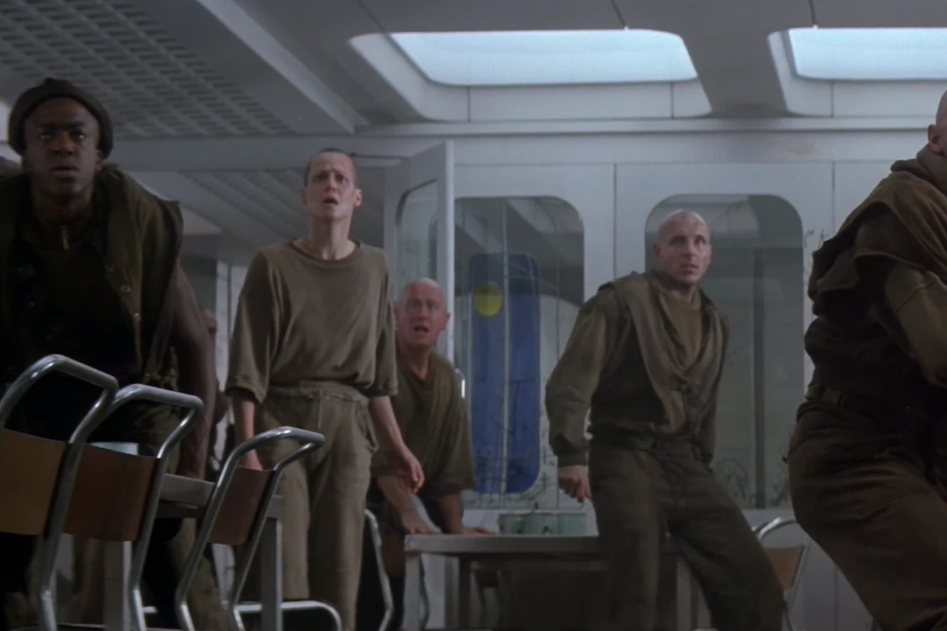 Morse at the Fiorina mess table as Ripley, Dillon, and Aaron watch Andrews taken