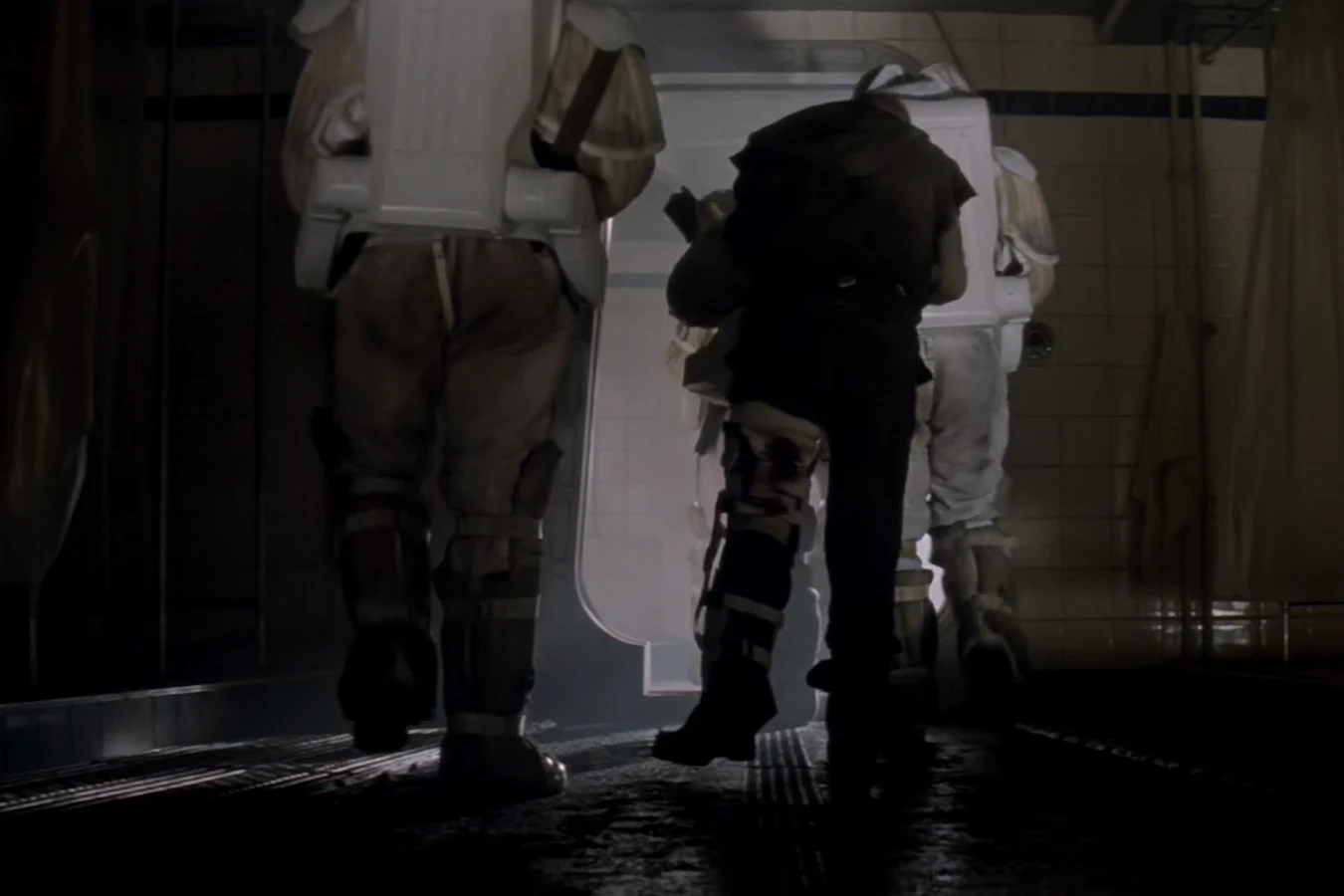 Weyland-Yutani troops in sealed suits escorting Morse off Fiorina 161