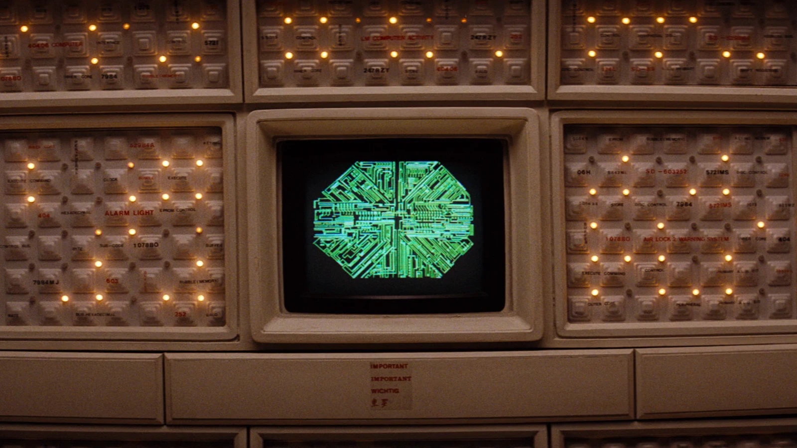 Mother's CRT monitor on the Nostromo, showing a green circuit hexagon among labeled wall panels