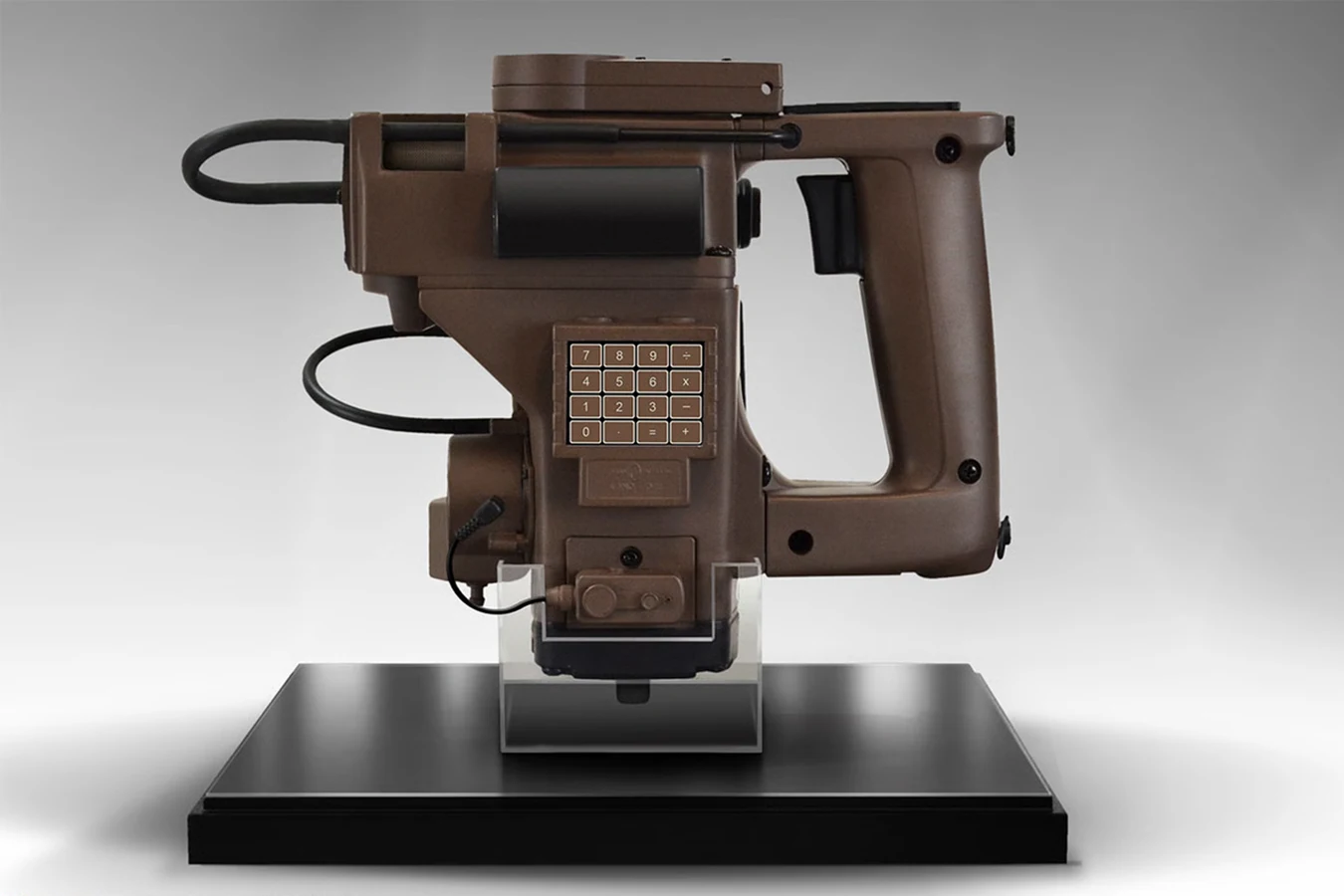 Sideshow Hollywood Collectibles Group M314 motion tracker replica on a black display stand