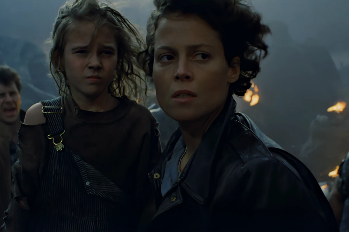 Newt and Ripley on the APC watching the dropship crash on the road between the atmosphere processor and Hadley's Hope in Aliens