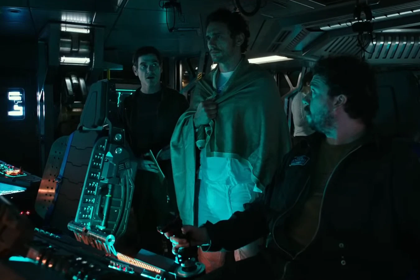 Jacob Branson wrapped in a blanket among the Covenant crew