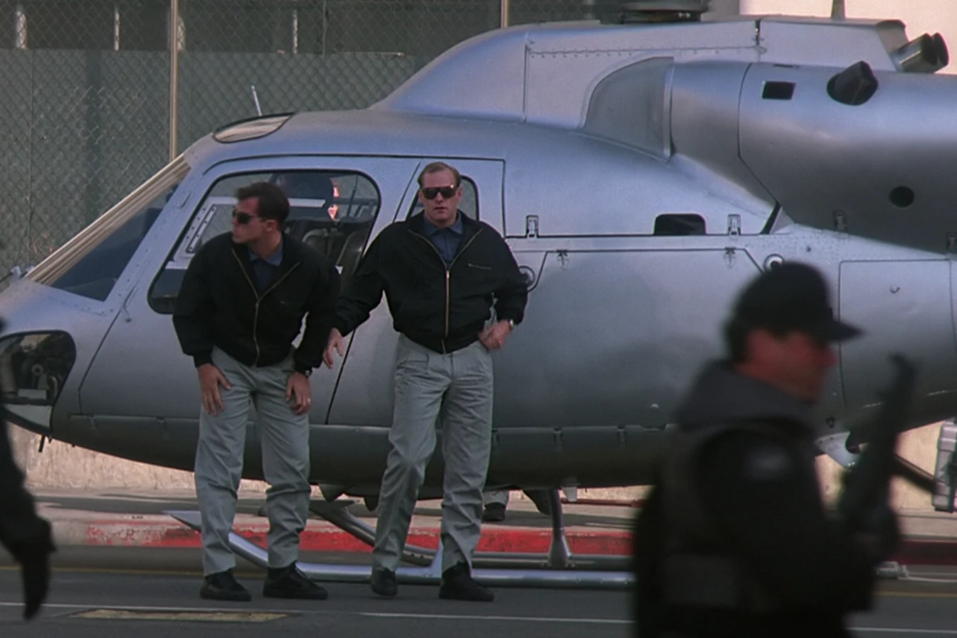 Peter Keyes and Garber beside an OWLF helicopter in Predator 2