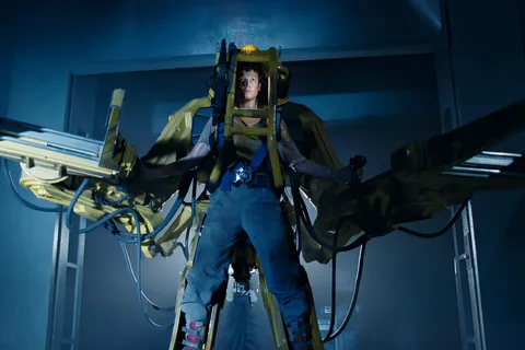 Ellen Ripley strapped into a Caterpillar P-5000 Power Loader in the Sulaco cargo bay in Aliens