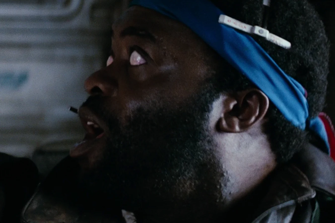 Parker in a jacket and blue headband during the landing on LV-426 in Alien
