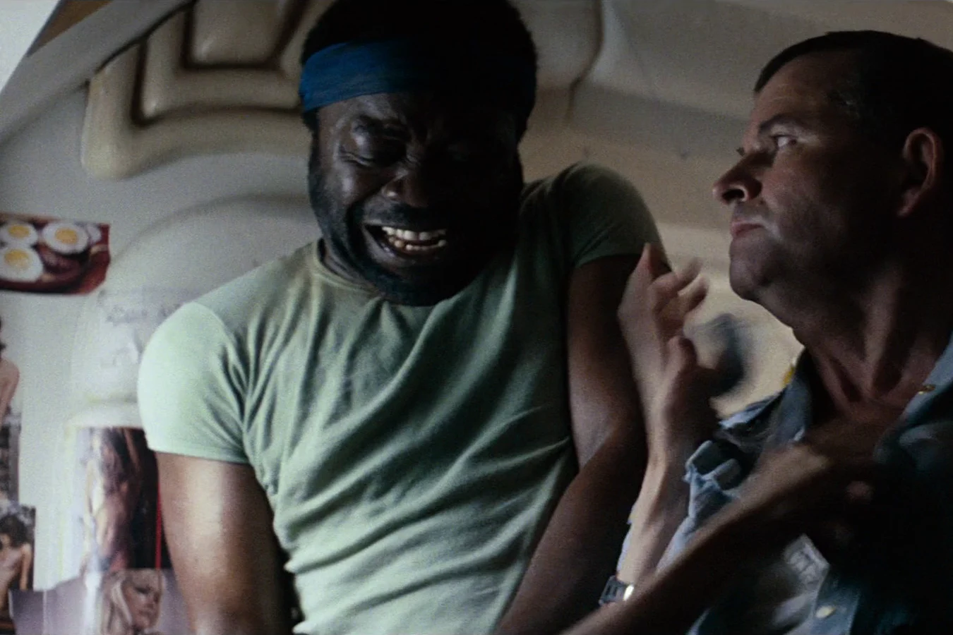 Parker grabs Ash by the collar in the Nostromo mess in Alien
