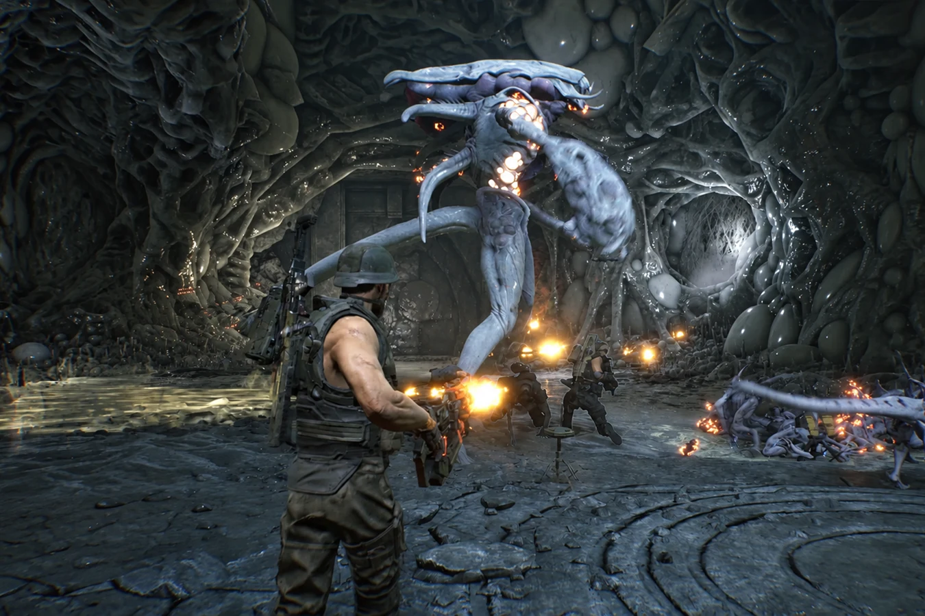 A Colonial Marine fireteam shooting the Pathogen Queen in a Pathogen hive under LV-895