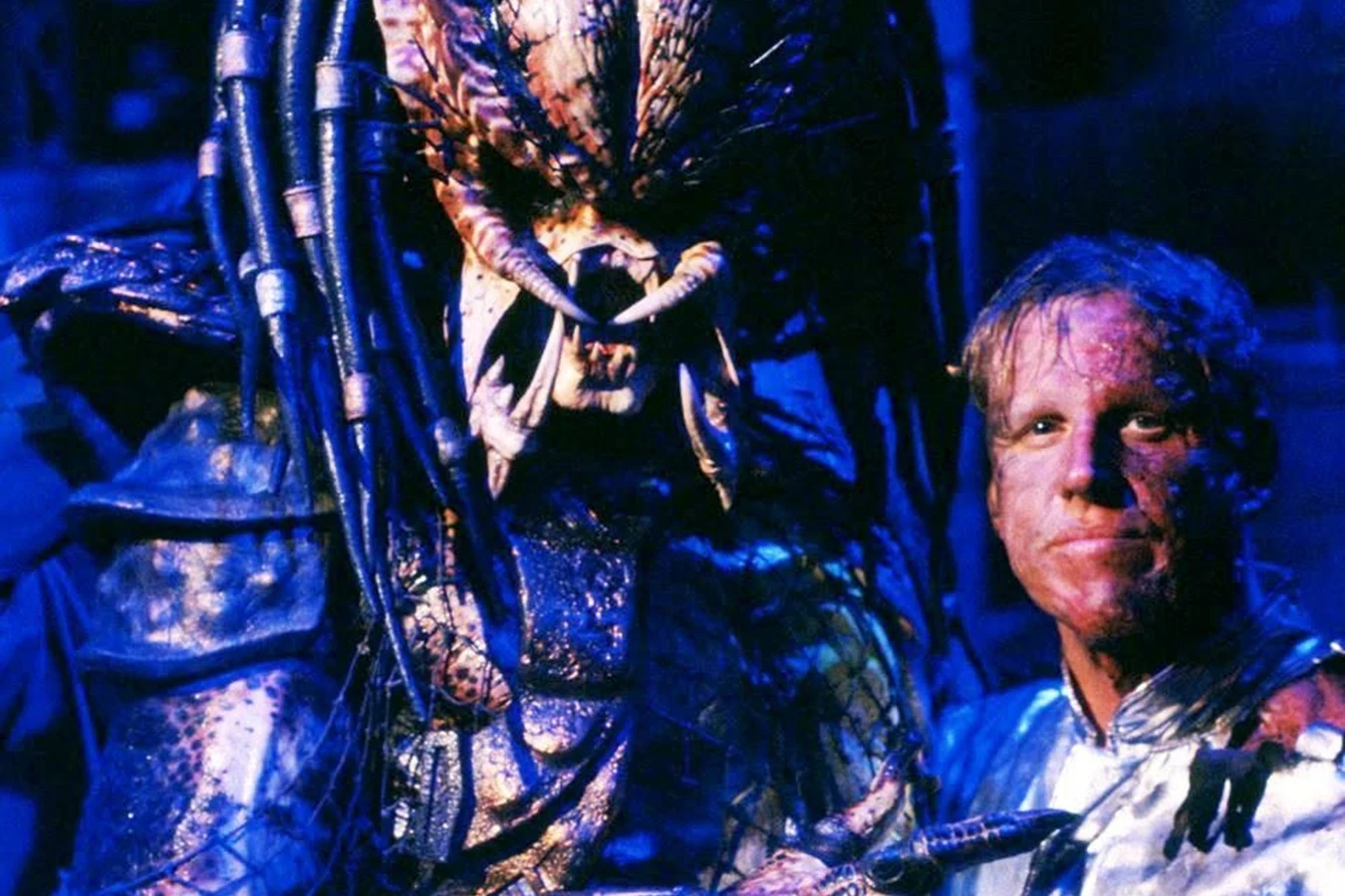 Gary Busey as Peter Keyes poses with the City Hunter on the Predator 2 set