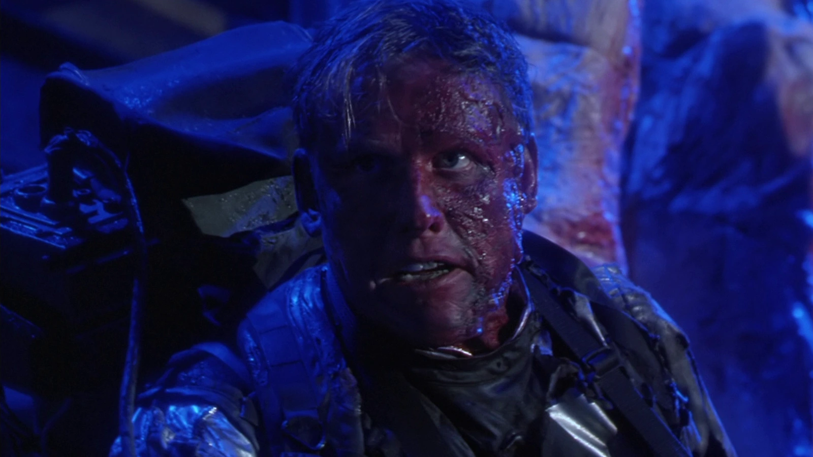 Peter Keyes bloodied in a refrigerated silver suit in the Predator 2 slaughterhouse