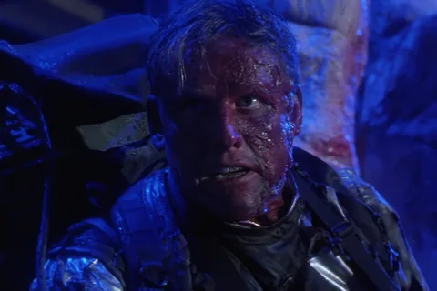 Peter Keyes bloodied in a refrigerated silver suit in the Predator 2 slaughterhouse