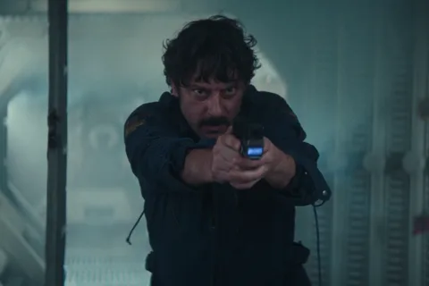 Petrovich in his Maginot chief engineer uniform with PETROVITCH name tape in Alien: Earth