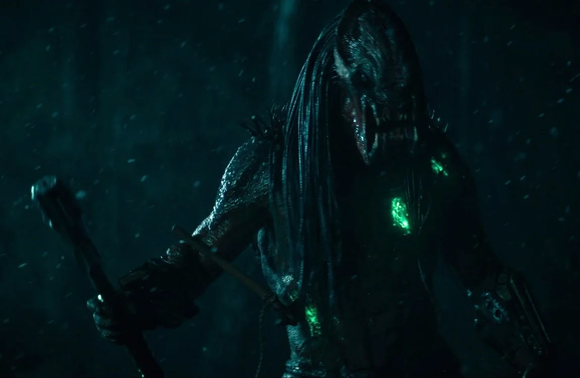Feral Predator with an axe stuck in his side