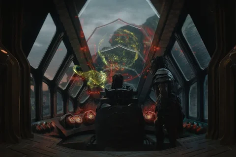Dek and Kwei looking at holograms of different planets on Kwei's ship from Predator: Badlands