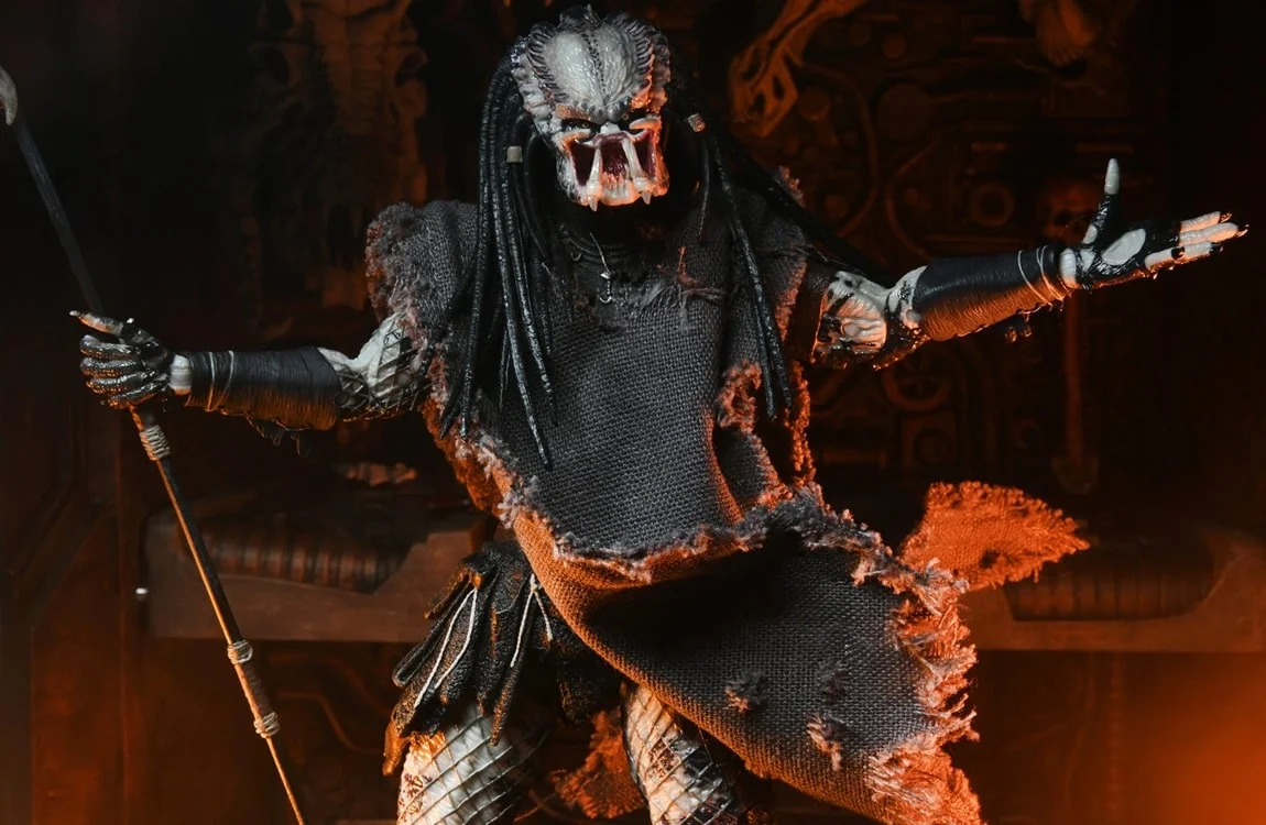A NECA figure of the Shaman Predator with a ragged cape