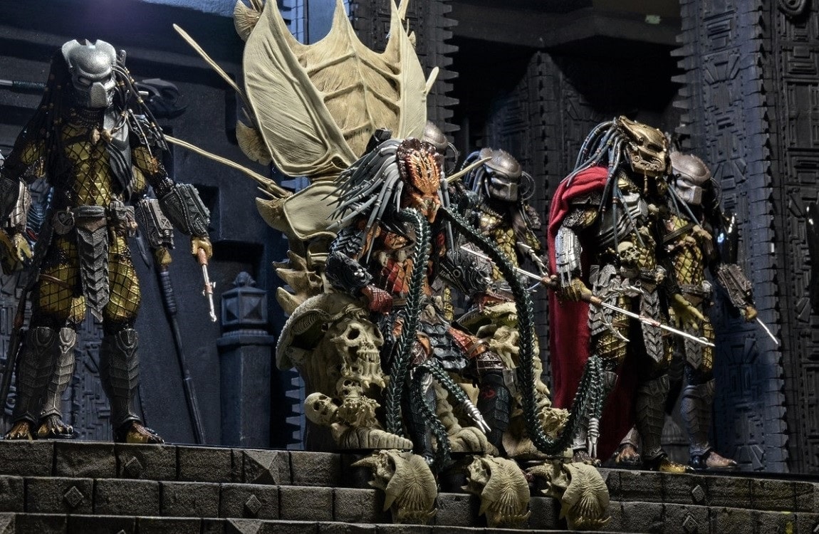 The Clan Leader Predator sits on a throne