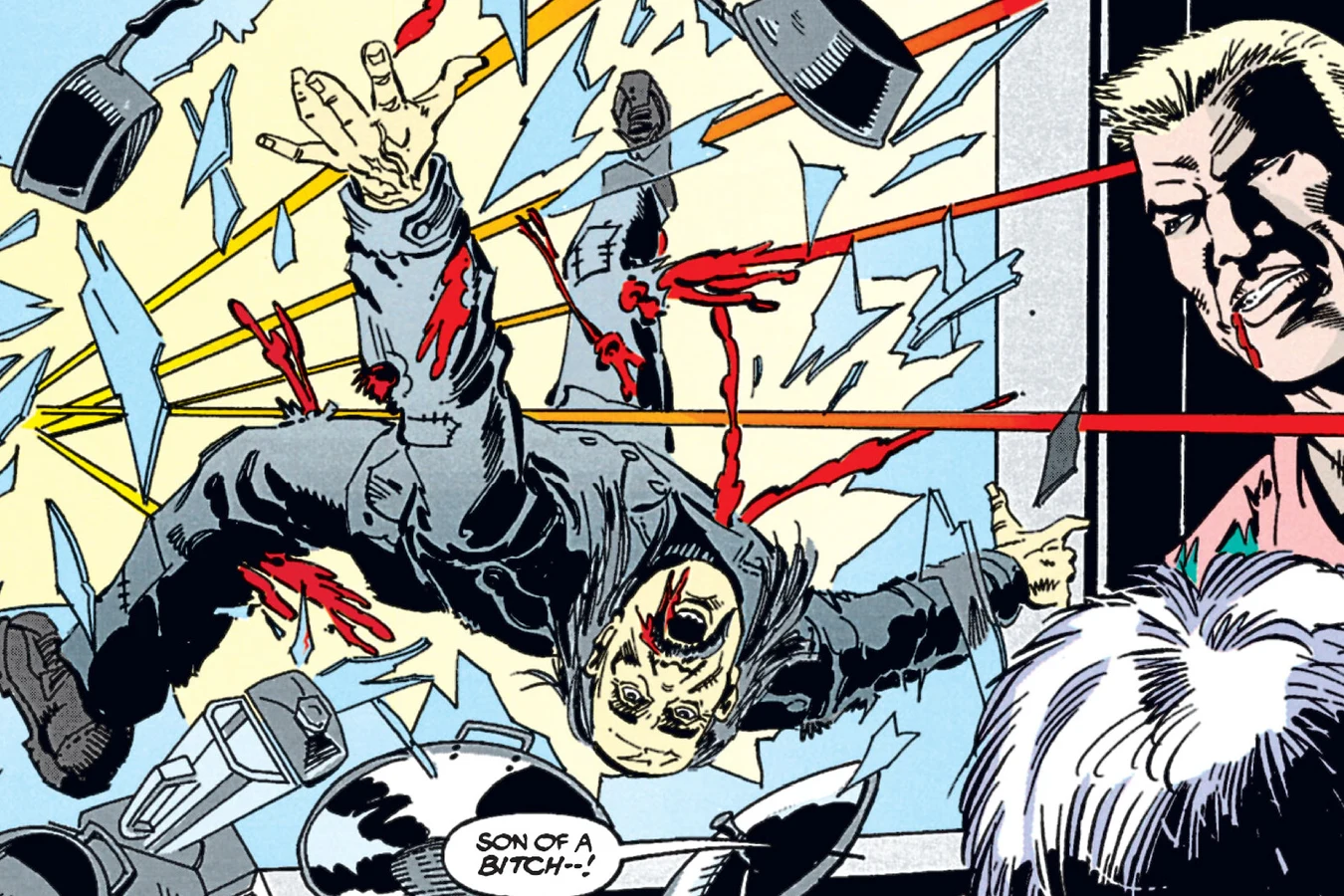 One of Baby's gunmen crashing backward through glass during the shootout in the kitchenware shop in the Predator: Cold War comic