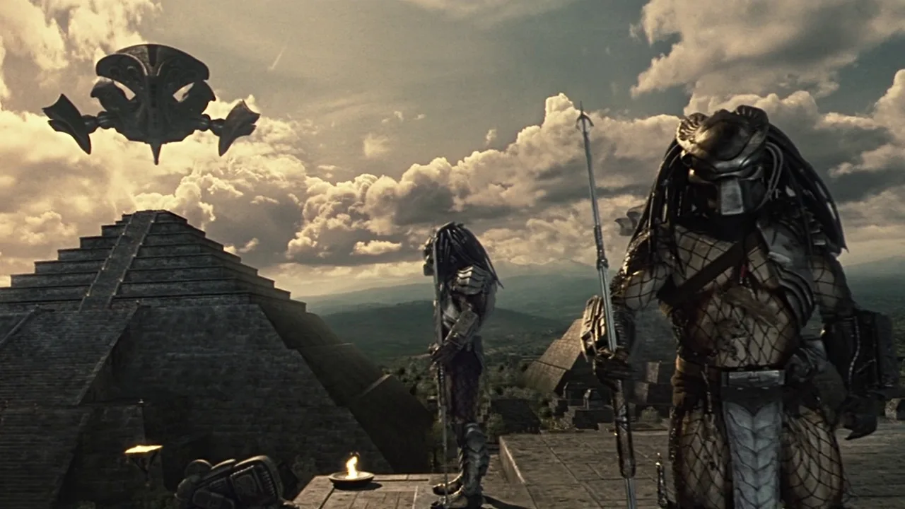 Predators standing on top of the temple in Central America with ships in the background in Alien vs. Predator