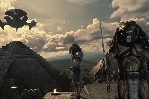 Predators standing on top of the temple in Central America with ships in the background in Alien vs. Predator