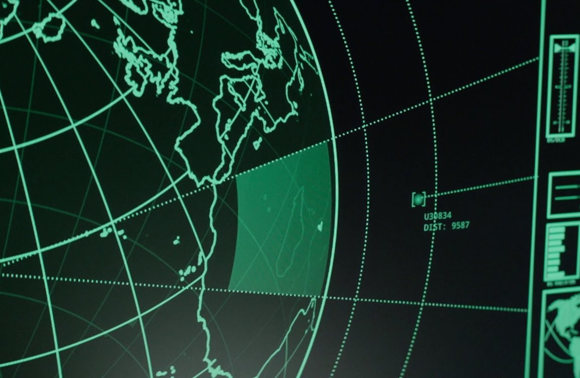 Green Earth tracking display on a ship monitor showing an object approaching from orbit in The Predator